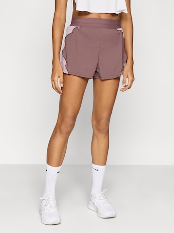 NIKE Regular Workout Pants 'Swift' in Pink: front