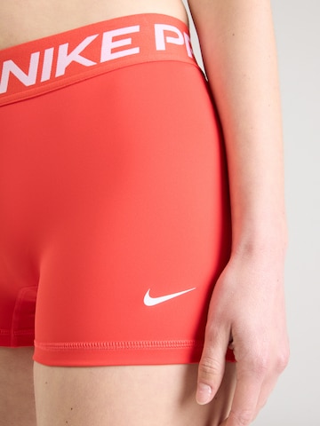 NIKE Skinny Workout Pants 'NP 365' in Orange