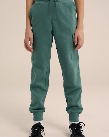 WE Fashion Zwężany krój Spodnie w kolorze zielony: przód
