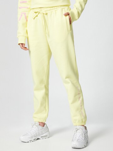 ABOUT YOU x Mero Loose fit Trousers 'Code' in Yellow