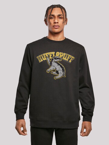 F4NT4STIC Sweatshirt 'Harry Potter Hufflepuff Sport Emblem' in Zwart: voorkant