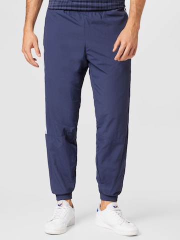 ADIDAS ORIGINALS Tapered Pants in Blue: front