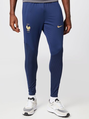 NIKE Skinny Workout Pants in Blue: front