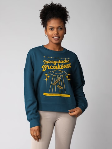 Watapparel Sweatshirt ' Intergalactic Breakfast ' in Groen: voorkant