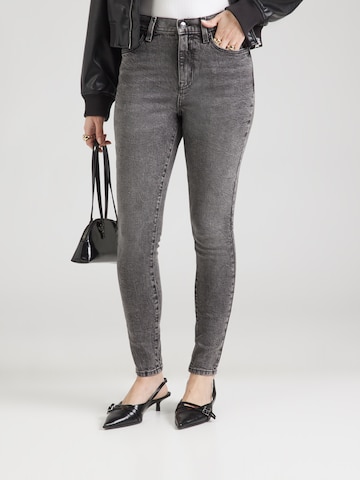 Skinny Jeans de la DKNY pe negru: față