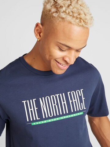 THE NORTH FACE T-shirt 'EST 1966' i blå