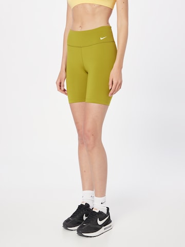 NIKE Skinny Workout Pants in Yellow: front