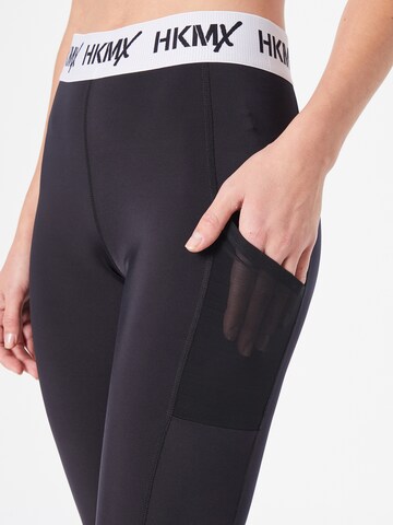 Skinny Pantaloni sportivi di HKMX in nero