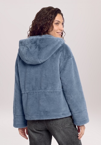 Cartoon Tussenjas in Blauw