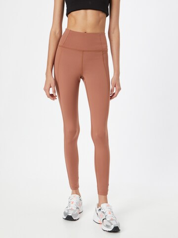 Girlfriend Collective Skinny Workout Pants in Brown: front