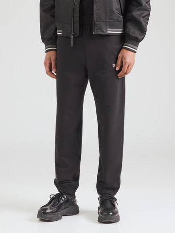 Calvin Klein Alt kitsenev Püksid, värv must: eest vaates