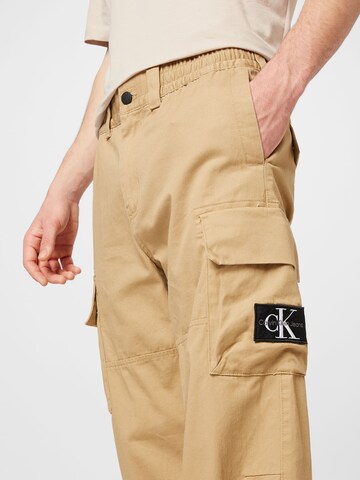 Loosefit Pantaloni cu buzunare de la Calvin Klein Jeans pe bej