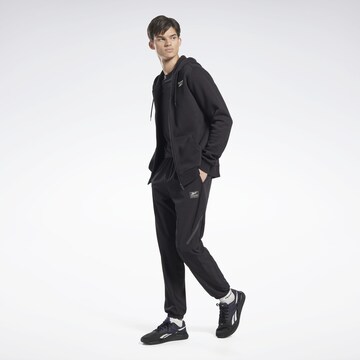 Tapered Pantaloni sportivi di Reebok in nero