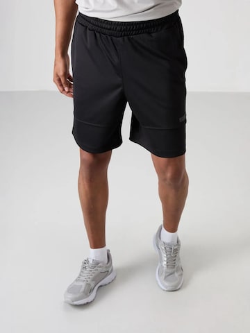 Pantalon de sport Tommy Life en noir : devant