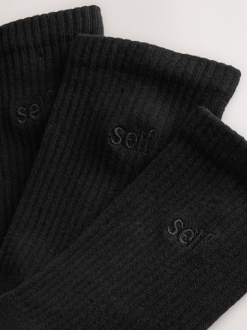 self. Socks in Black