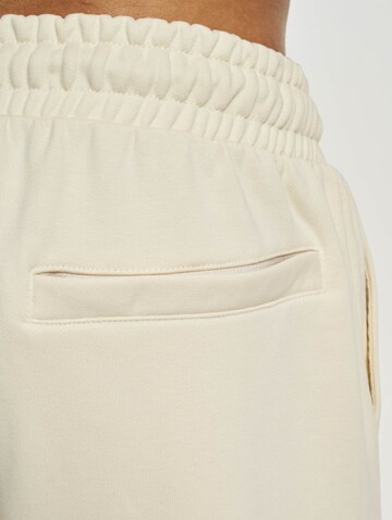 Tapered Pantaloni di Urban Classics in beige