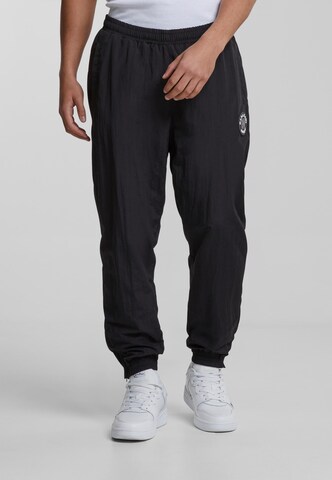 Effilé Pantalon de sport 'KM-PL074-001-01' Karl Kani en noir : devant