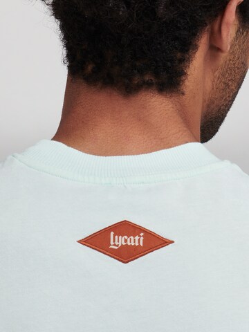 LYCATI exclusive for ABOUT YOU Shirt 'Vanilla Saturn' in Blau