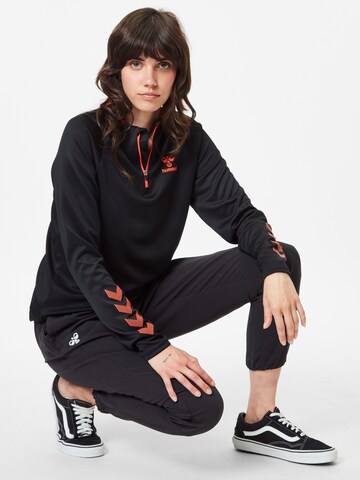 Effilé Pantalon de sport Hummel en noir