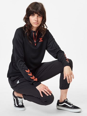 Effilé Pantalon de sport Hummel en noir