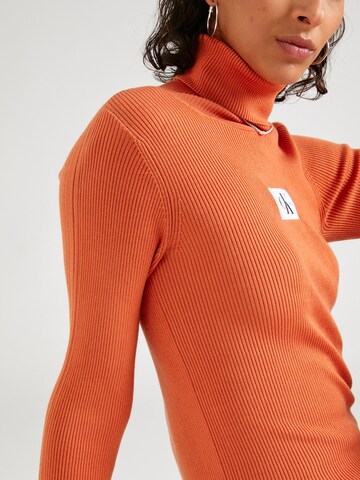 Calvin Klein Jeans Pulover | oranžna barva