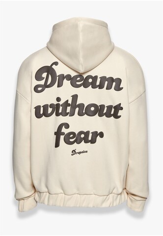 Dropsize Collegetakki 'Dream Without Fear' värissä beige