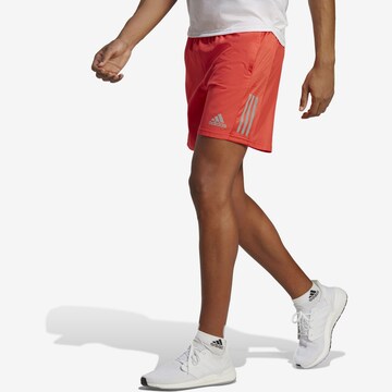 ADIDAS SPORTSWEAR Regular Workout Pants 'OWN THE RUN' in Orange: front