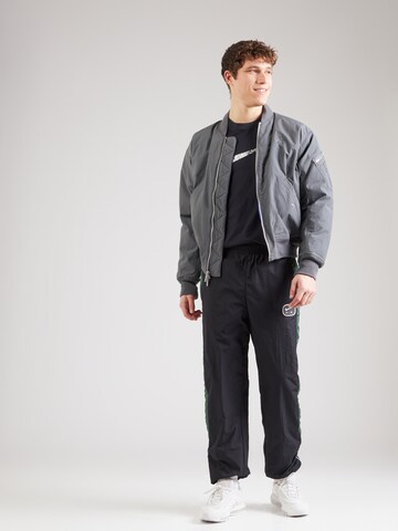 Loosefit Pantalon 'AIR' Nike Sportswear en noir