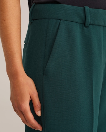 žalia WE Fashion Standartinis Kelnės su kantu