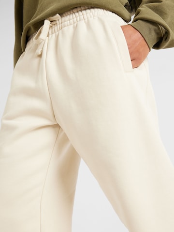 TOPMAN Zwężany krój Spodnie w kolorze beżowy