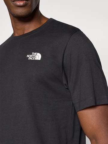 Tricou 'BOX NSE CELEBRATION' de la THE NORTH FACE pe negru