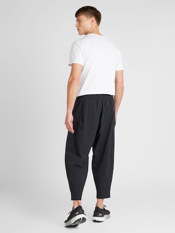 Regular Pantaloni sport 'Unstoppable Airvent' de la UNDER ARMOUR pe negru