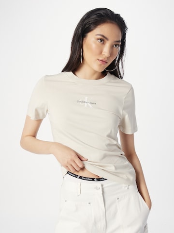 Calvin Klein Jeans Tričko – béžová: přední strana