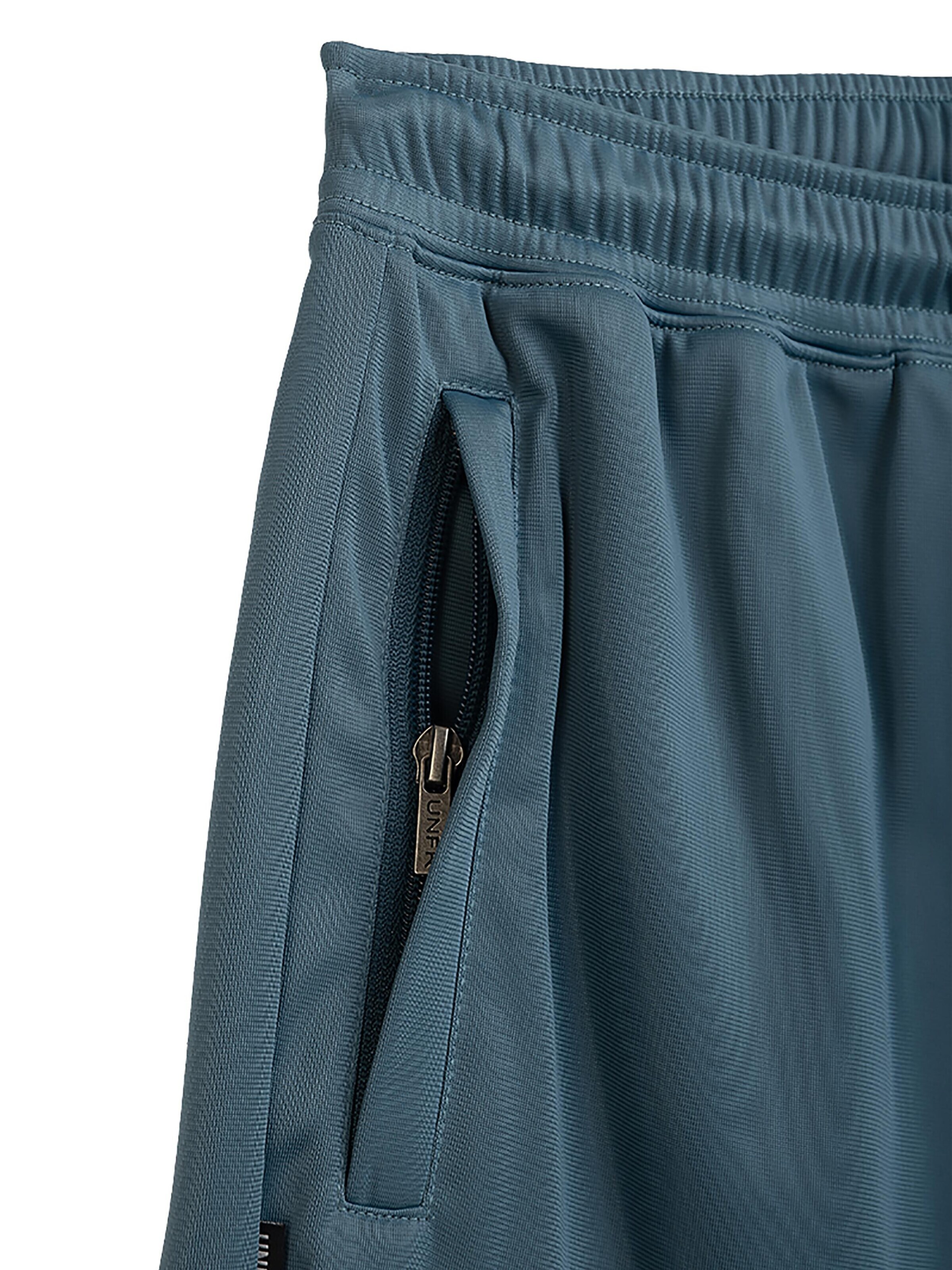 Loosefit Pantalon de sport 'Athletic DMWU' Unfair Athletics en bleu