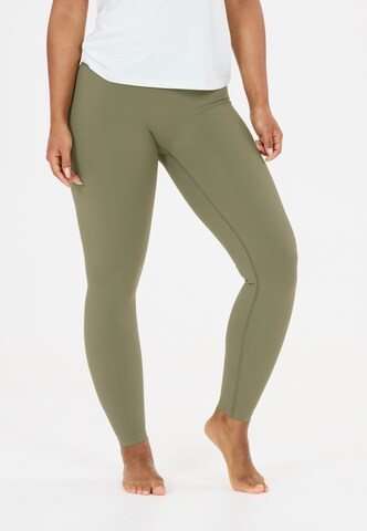 Athlecia Skinny Sports trousers 'Luxe V2' in Green: front