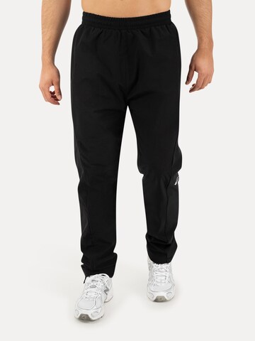 Loosefit Pantalon de sport Smilodox en noir : devant
