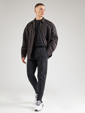 Champion Authentic Athletic Apparel - Tapered Pantalón deportivo en negro