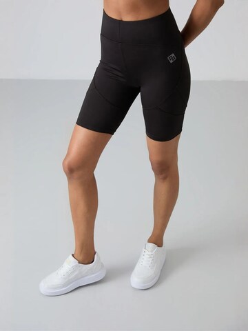 Effilé Leggings 'Gamaschen' Tommy Life en noir