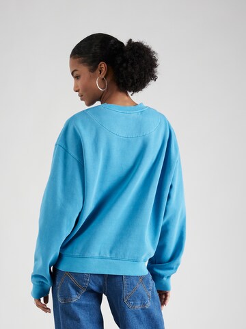 Sweat-shirt 'Essence Standard' WEEKDAY en bleu