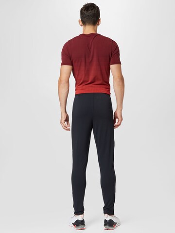 Skinny Pantaloni sport de la UNDER ARMOUR pe negru