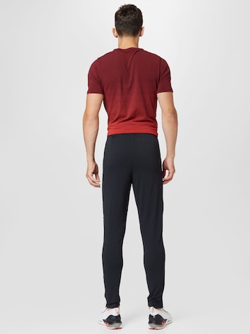 UNDER ARMOUR Skinny Sports trousers in Black