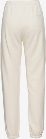 Champion Authentic Athletic Apparel Tapered Workout Pants in Beige