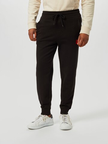 Tapered Pantaloni 'Doak' di HUGO in nero: frontale