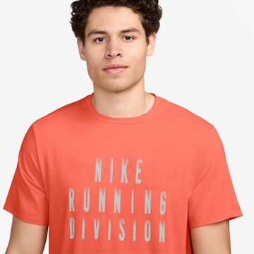 NIKE Funktionsshirt 'Rise 365' in Orange