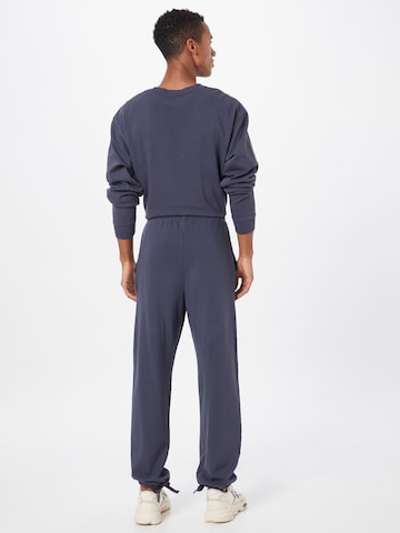 ABOUT YOU Limited Loose fit Pants 'Luis' by Jannik Stutzenberger' in Blue