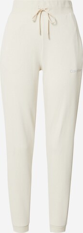 Pantalon Calvin Klein Sport en beige : devant