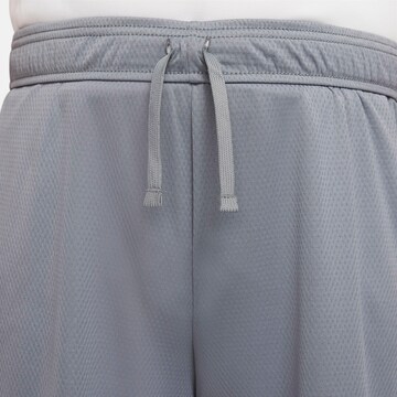 NIKE Regular Workout Pants in Grey