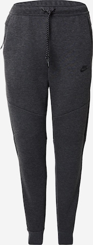 pilka Nike Sportswear Siaurėjantis Kelnės 'TCH FLC': priekis