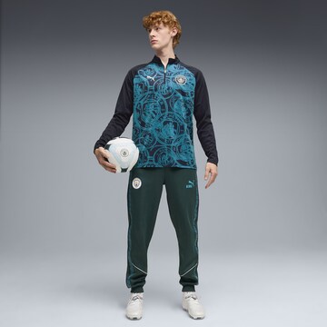 T-Shirt fonctionnel 'Manchester City' PUMA en bleu