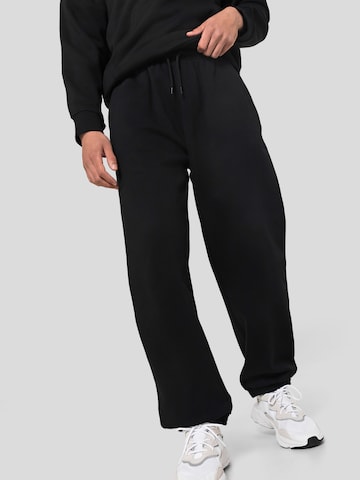 WEEKDAY Tapered Trousers in Black: front